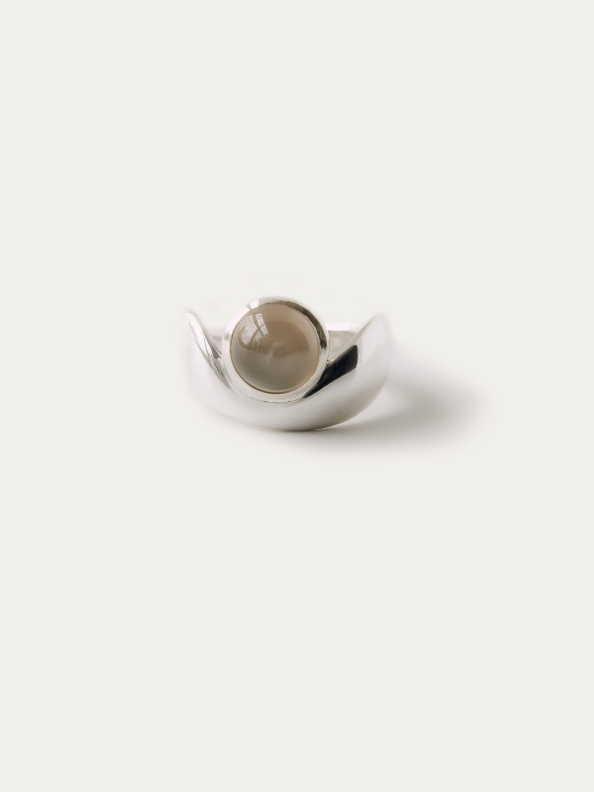 SINUOUS RING WITH ROUND GEMSTONE